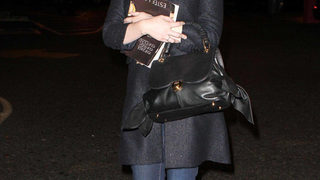 Christina Hendricks Mixes Jeans With Joan Holloway-Inspired Hat & Bag